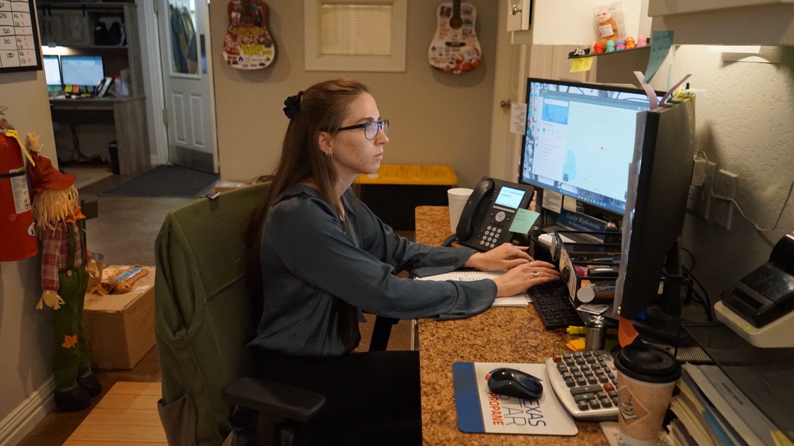 A Texas Star office team member at a dispatch desk.