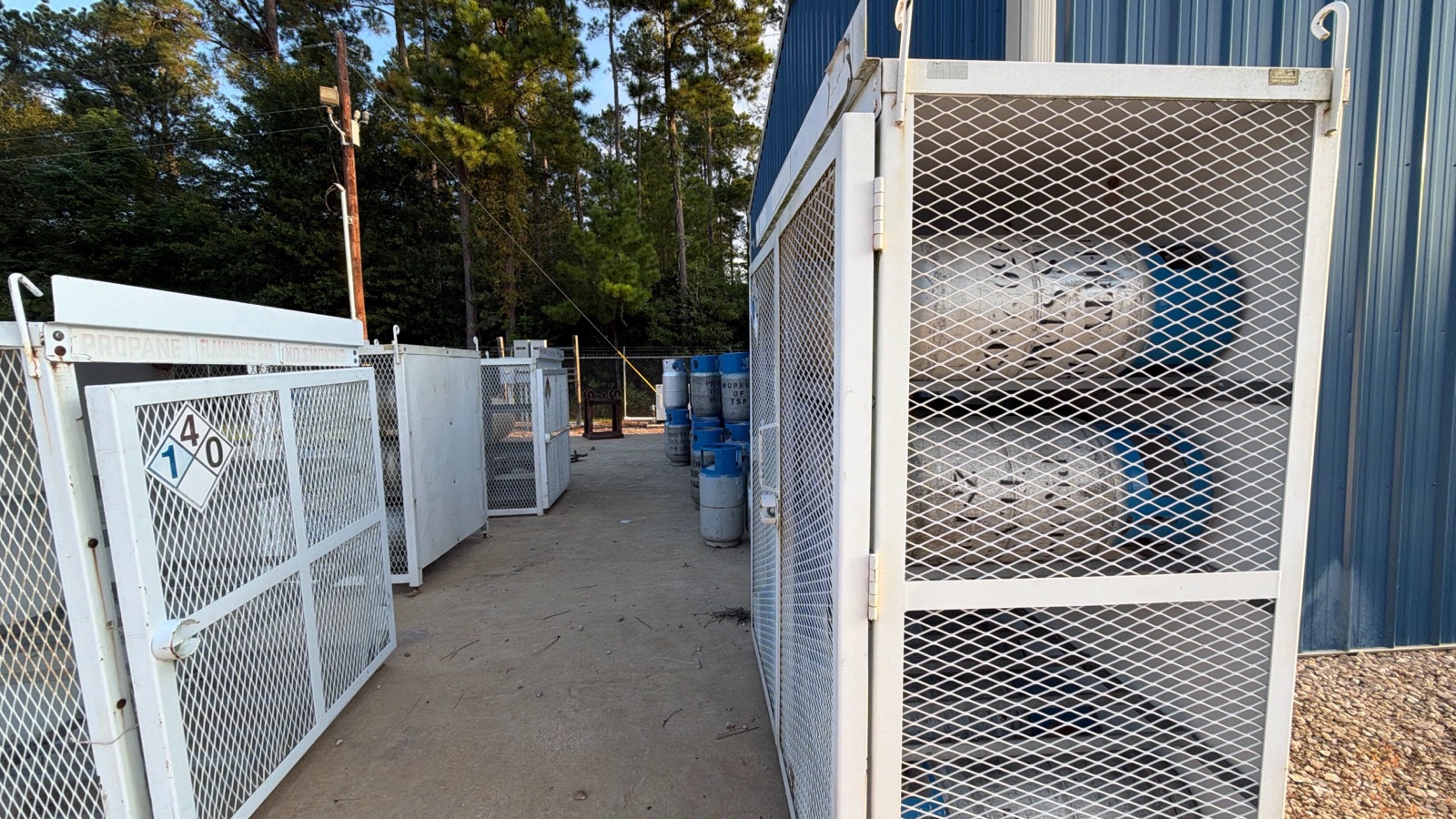 Cylinder storage cages holding forklift propane bottles.