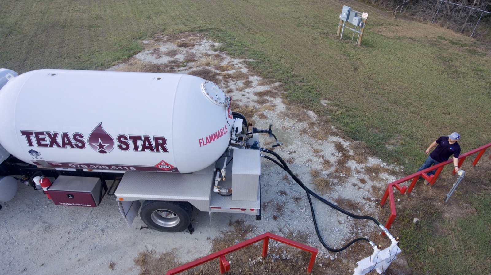 An aerial view of a Texas Star tank truck delivering at a bulk plant.
