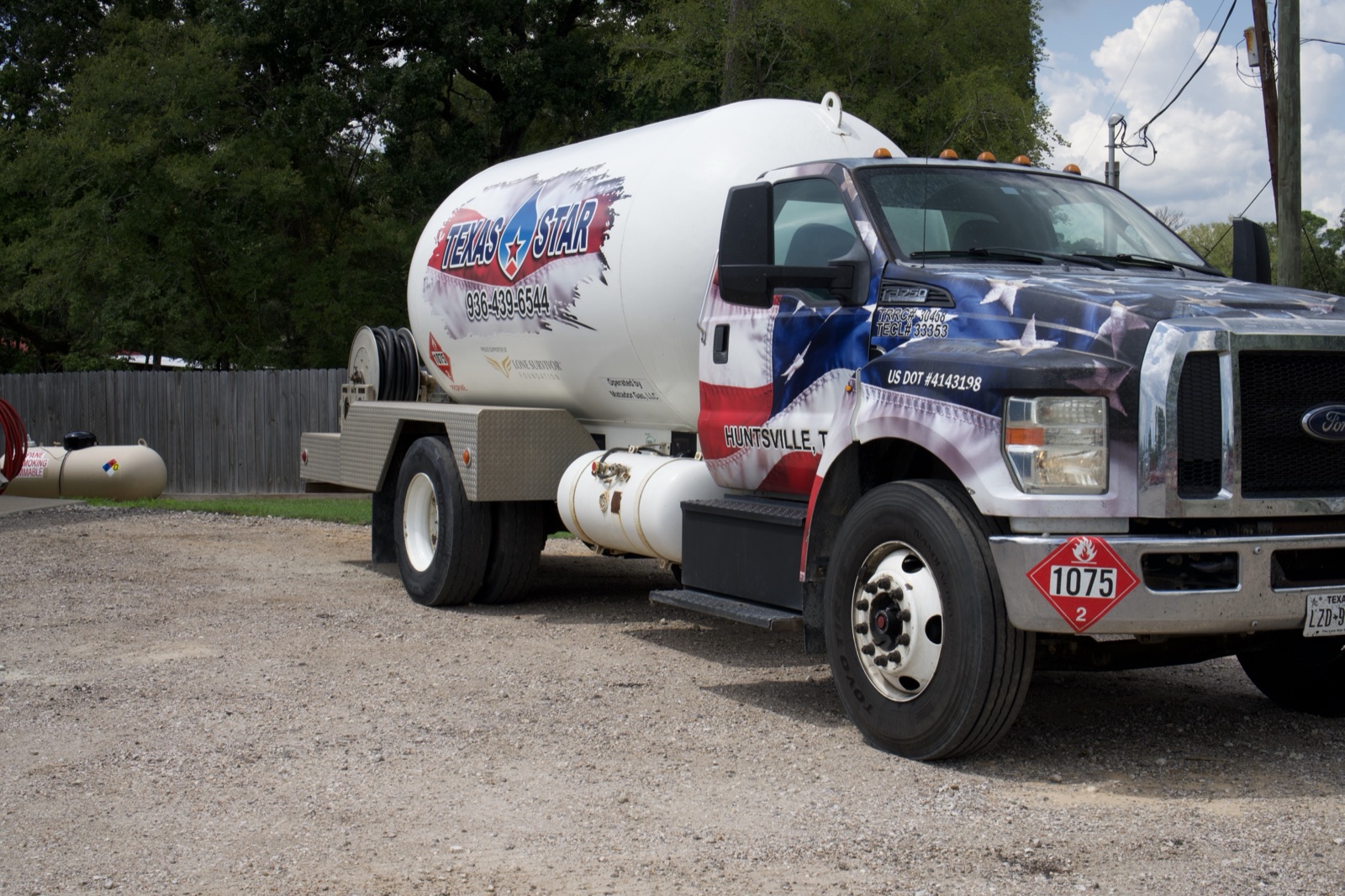 A branded Texas Star propane truck with signage visible.